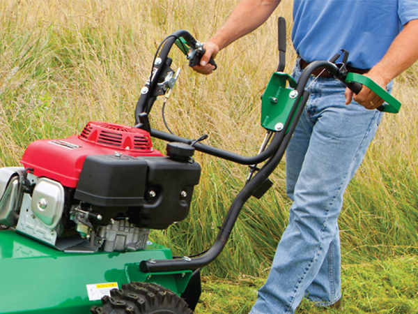 Man using a Billy Goat brushcutter in field