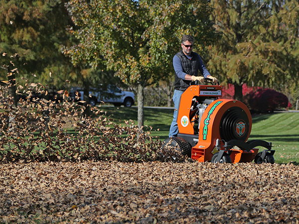 Man on Hurricane Blower with Leaves Blowing