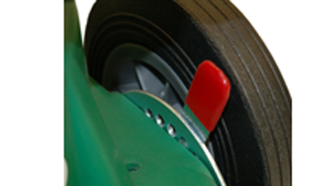 a close up of a green and red helmet